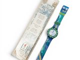 an image of a watch sitting next to a package of toothbrushes