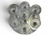 a glass object that is sitting on a white surface