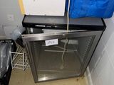 an image of a small kitchen with a refrigerator and a dishwasher