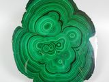 a picture of a piece of green agate on a white surface