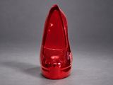 a red shoe that is sitting on top of a table