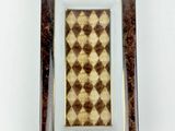 brown and white checkered glass plate with gold trim
