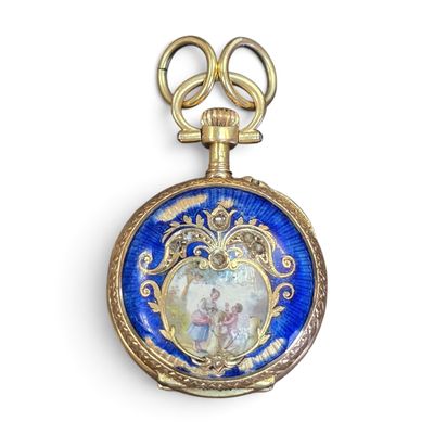 une montre de poche bleue et dorée sur laquelle figure une image