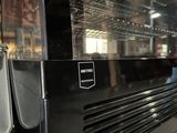 a close up of a black oven with the door open
