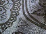 an image of a close up of a blue and black paisley fabric