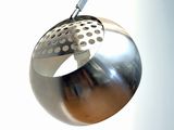 a metal object hanging from the ceiling in a room