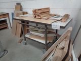several pieces of wood are stacked on a table in a room