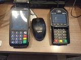 two cell phones and a computer on a desk