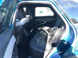 a blue car that is sitting in the back of the car