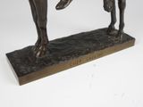 bronze statue of a man riding a horse with a child on his back