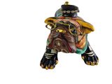 a figurine of a dog wearing a hat and holding a pipe