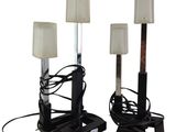 pair of black and white lamps with shades on them on a white background