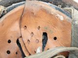 a close up of a pair of shoes with holes in them