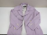 purple blazer jacket on a table with a white shirt underneath it