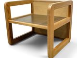 a wooden bench with a shelf on top of it