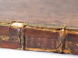 an old book that is sitting on a table