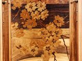 a picture of a wooden cabinet with a painting on it
