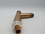 a close up of a brass pipe on a white surface