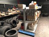 a lot of tires and boxes in a garage