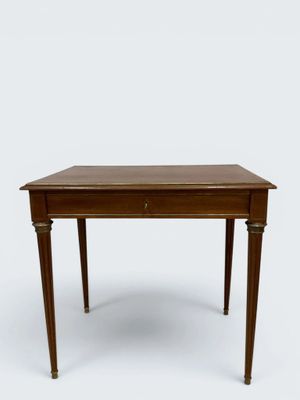 an image of a small wooden table with a drawer on the top