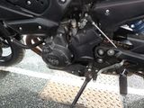 a close up of a motorcycle engine on the ground