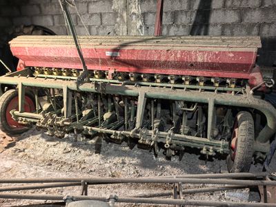 a man that is working on a machine in a building