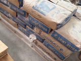 a large pile of boxes on a pallet in a warehouse