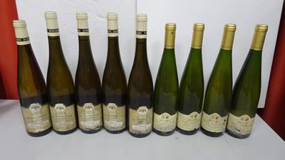 six bottles of wine are lined up in a row on a table