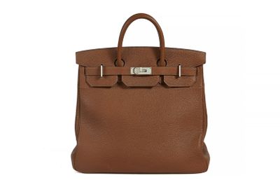 a brown leather handbag on a white background