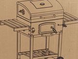 cardboard box with a drawing of a barbecue oven on it