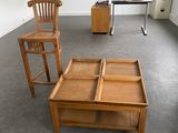 two wooden chairs and a coffee table in a room