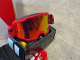a pair of ski goggles and a pair of socks on the ground