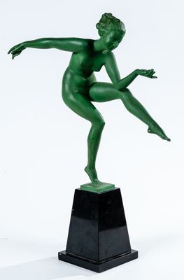 an image of a green statue of a man on a pedestal