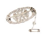 a close up of a brooch with a safety pin attached to it