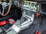a car dashboard with a steering wheel and gauges in it