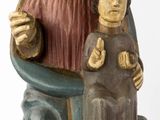 a statue of jesus holding a child and giving a thumbs up