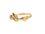 a close up of a gold ring on a white background