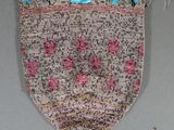 an image of a purse with a pair of scissors in it