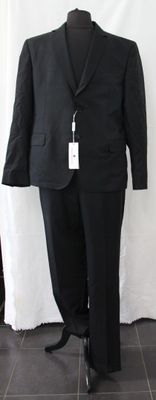 a black suit on a mannequin on a stand