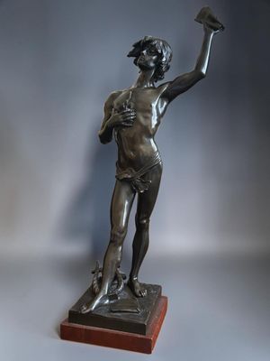a bronze statue of a woman holding a fan on a wooden base