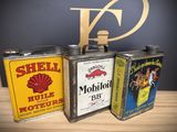 three tins that are sitting on a table