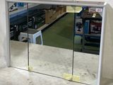a mirror that is on the wall in a store