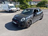 a small car that is parked in the parking lot