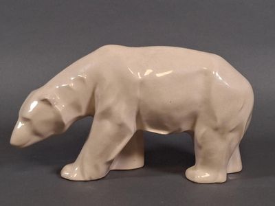 a white bear statue on a gray surface