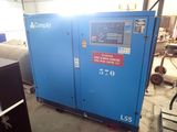 a blue compressor sitting in a warehouse next to other machines