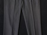 a pair of black slacks on a black background