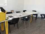 a room with a table and chairs in it
