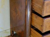 an image of a wooden chest of drawers on a hard wood floor