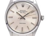 une photo d'une montre Rolex avec un cadran blanc et un bracelet