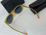 yellow sunglasses with blue lenses and a black case on a white surface